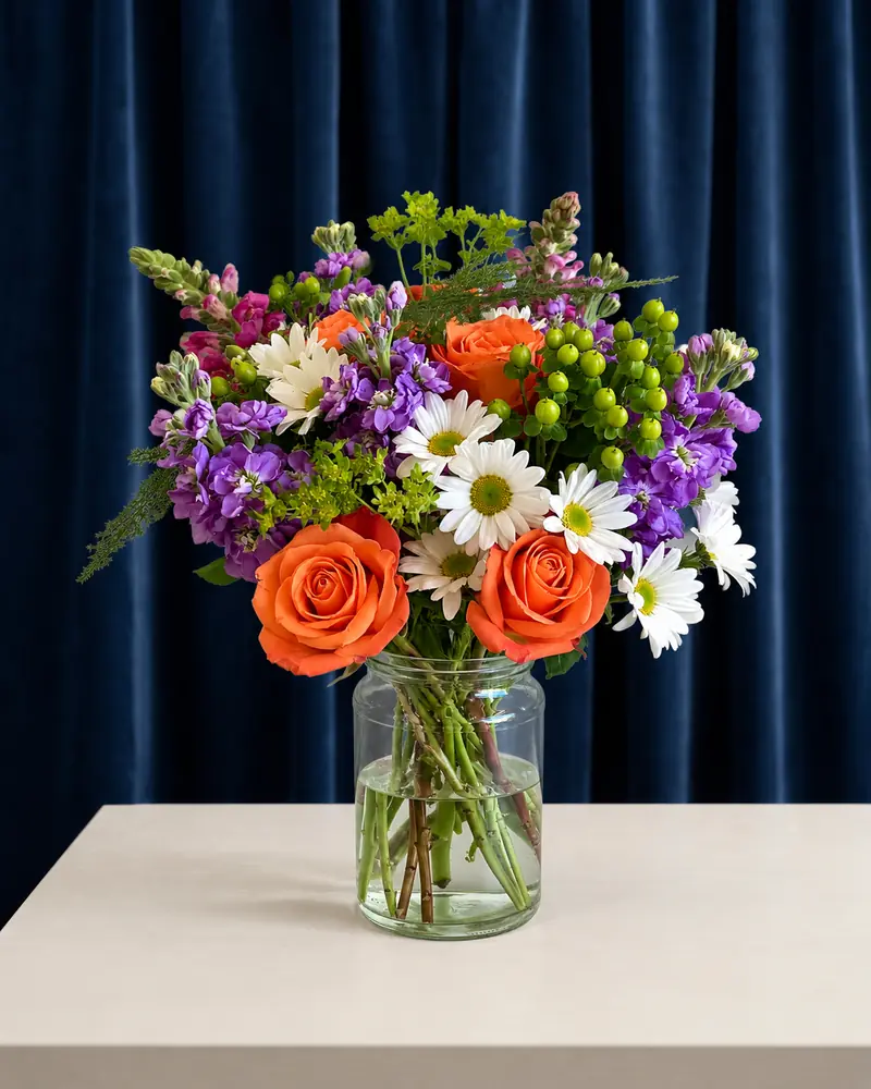 Example with sample flowers: a vase arrangement in the Velvet studio · midnight blue room, kept as made