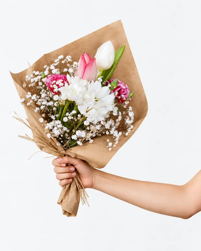 Example with sample flowers: a wrapped bouquet in the Hand-tied · white catalogue room, kept as made